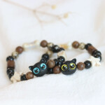 Pulsera de cuentas neko negro ojos de colores